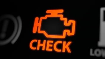 Car engine check light illuminated on dashboard at Rob's Auto Repair.
