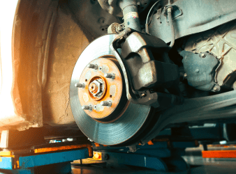 Brake system being inspected on a vehicle for safety and performance.