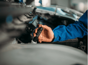 Engine diagnostics being performed by a technician at Sam's Auto Repair.