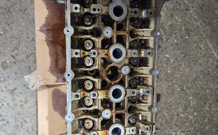 Cylinder head from Sanfelippo Auto Repair for engine service and inspection.