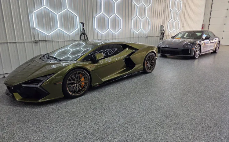 Lamborghini sports cars in a modern workshop by Sanfelippo Auto Repair.