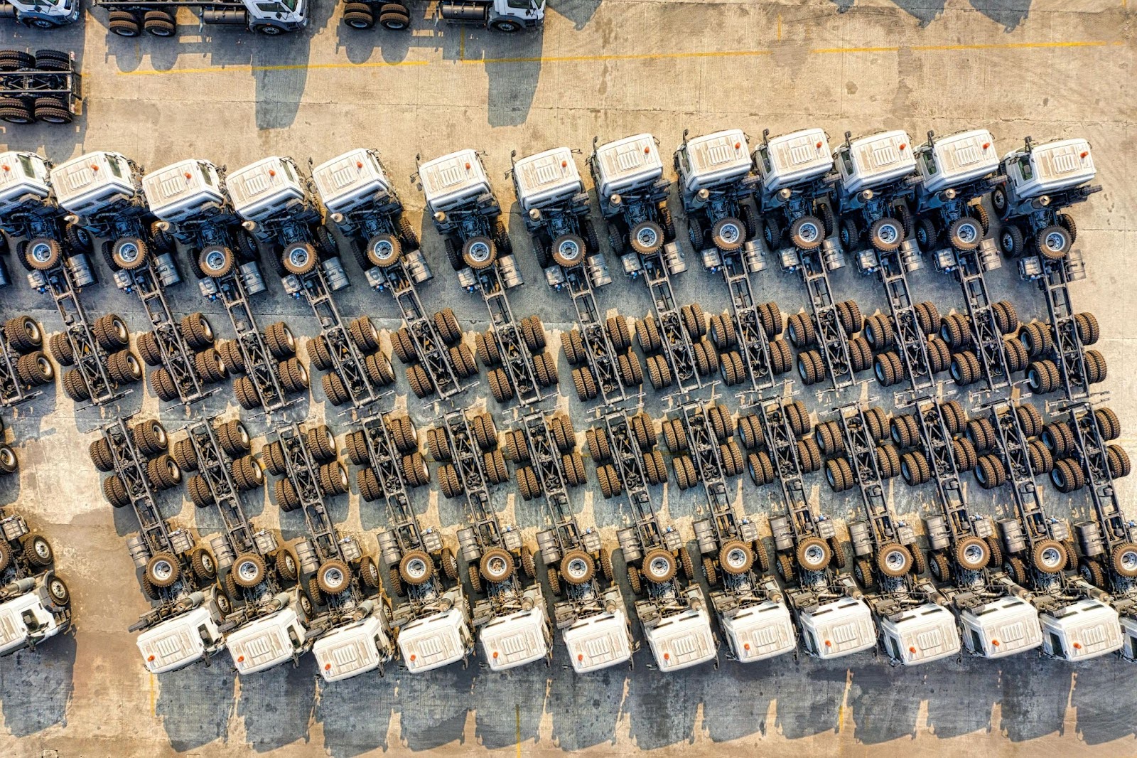 Fleet vehicles parked in a lot, ready for service.