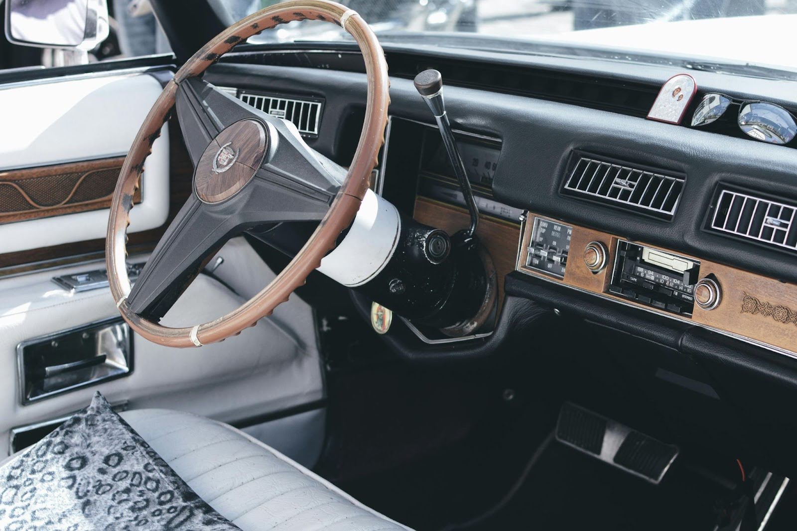 Classic vehicle dashboard with transmission and steering components.