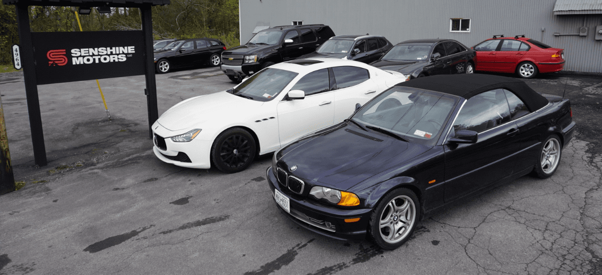 Modern car repair shop with luxury vehicles in Westmoreland, NY.