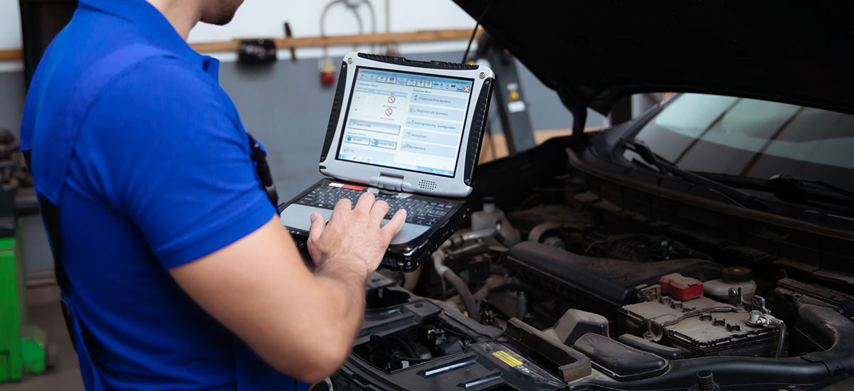 Advanced diagnostic testing being performed on a vehicle engine.