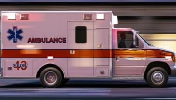 Ambulance with medical emergency equipment and siren lights.