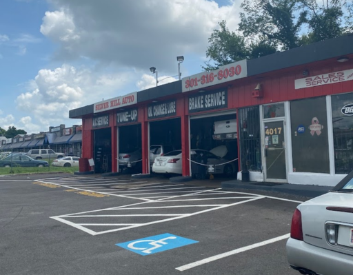 Auto repair shop with service bays and cars being serviced at Silver Hill Auto Repair, offering brak.
