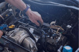 Skilled technician performing car engine repair at Silver Hill Auto Repair.