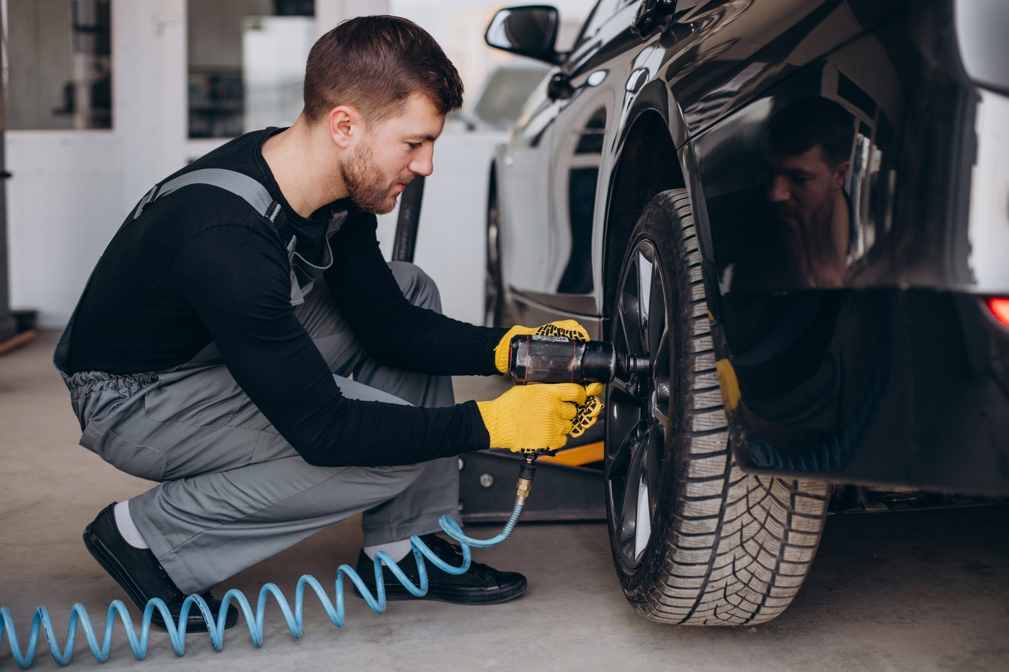 Mechanic conducting tire repair