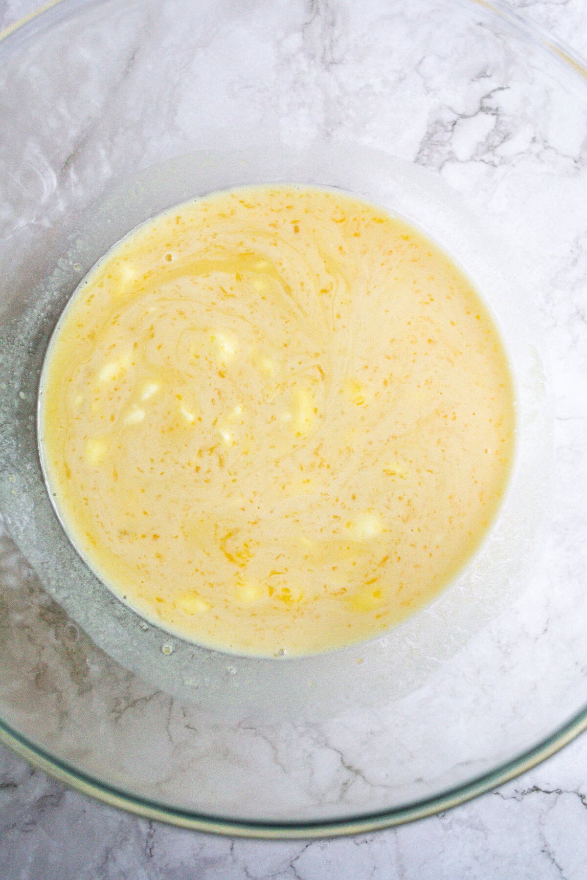 Creamy batter mixture for baking or cooking recipes, in a glass bowl.