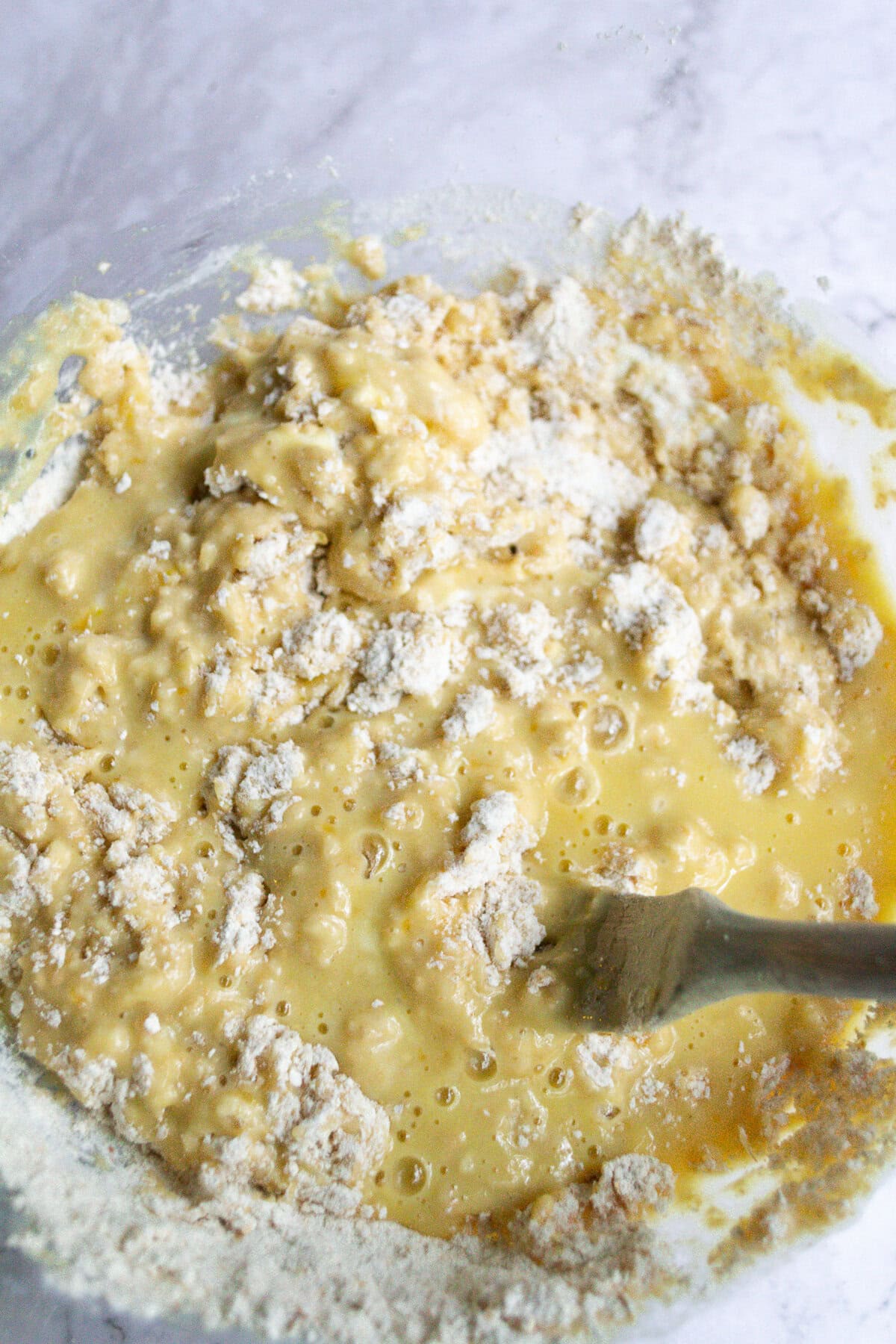 Buttermilk biscuit dough with flour, butter, and liquid ingredients mixed together, ready to be shaped or baked into fresh homemade biscuits.