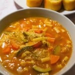 Healthy vegetable soup with zucchini, carrots, and noodles in a savory broth. Perfect for a nutritious meal, loaded with fresh vegetables and rich flavors. Great for lunch or dinner.