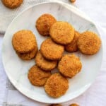 Crunchy homemade fried chicken nuggets on a white plate, perfect for snacks or meals, featured on Simply Fresh Foodie website.