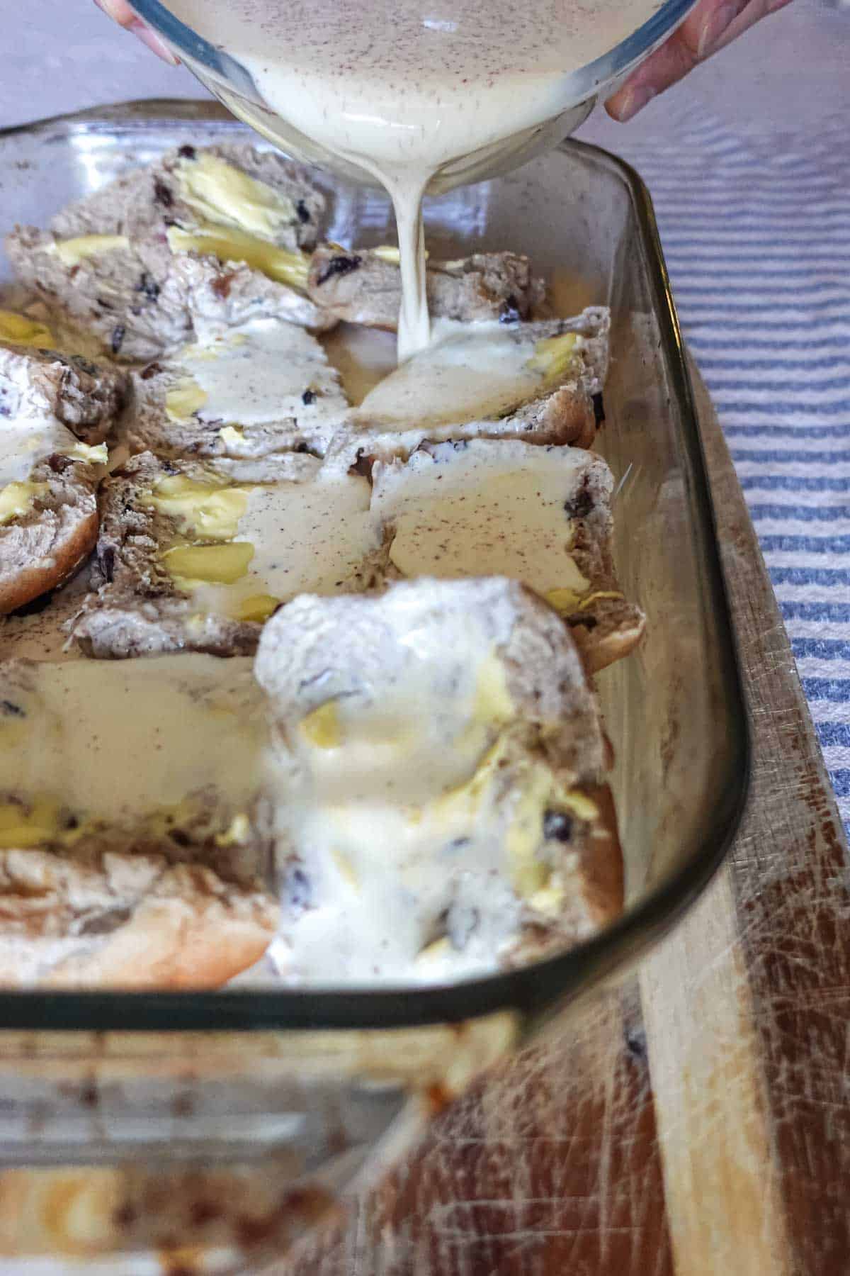 Creamy mushroom chicken casserole being prepared with a homemade white sauce. This comfort food recipe features tender chicken, mushrooms, and melted cheese, perfect for a family dinner.