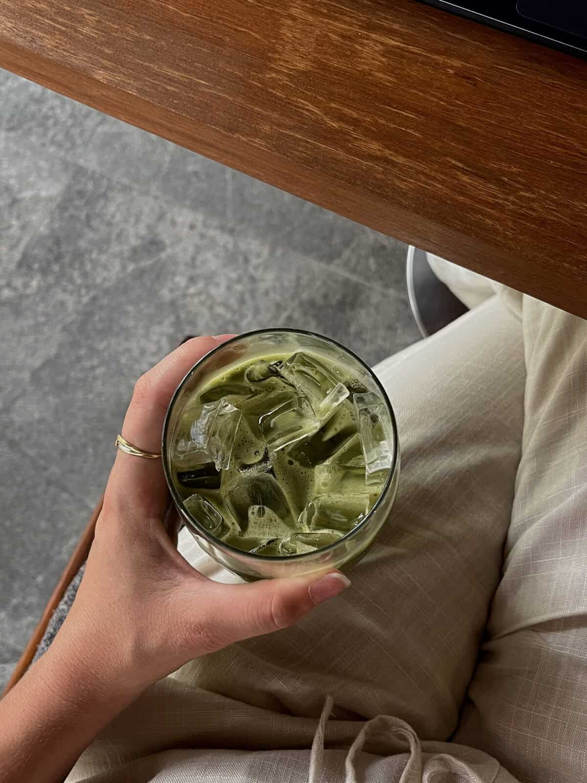 Chilled iced matcha latte with ice cubes and vibrant green color