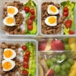 Savoury ground meat lunch containers with boiled eggs, cherry tomatoes, lettuce, and rice