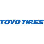 Exterior view of Slayton Tireworks tire shop showcasing tire displays and service bays.