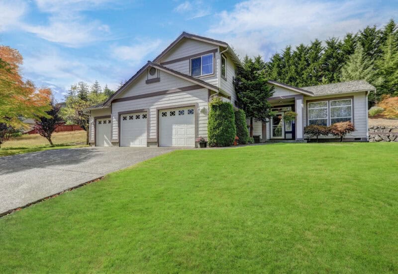 An image that shows Luxury House Exterior With Three Garage Spaces