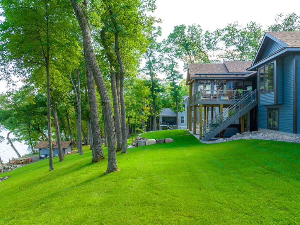Beautiful lush green lawn with new installation near house.