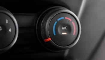 A/C climate control knob in a vehicle dashboard.