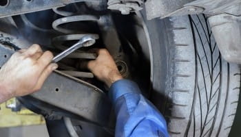 Wheel alignment being performed on a vehicle at Suttons Custom Automotive.