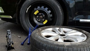 Vehicle wheel repair and tire replacement service at Suttons Custom Automotive.