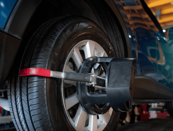 Professional tire alignment being performed on a vehicle at Teays Valley Auto.