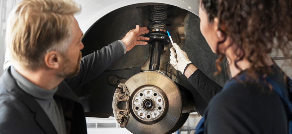 Brake system inspection during vehicle maintenance at Teays Valley Auto.