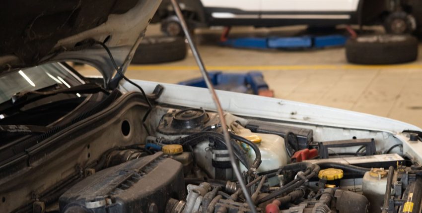Technician running engine diagnostics after a check engine light