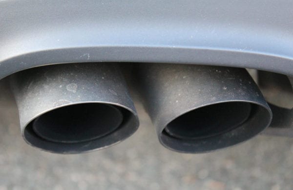 Dual exhaust pipes on a vehicle at Techline Motors.