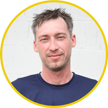 Man smiling at Techline Motors, a trusted NAPA Autopro service center.