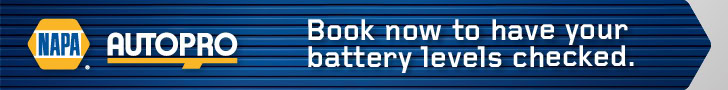 NAPA Autopro technician checking car battery levels at Techline Motors.