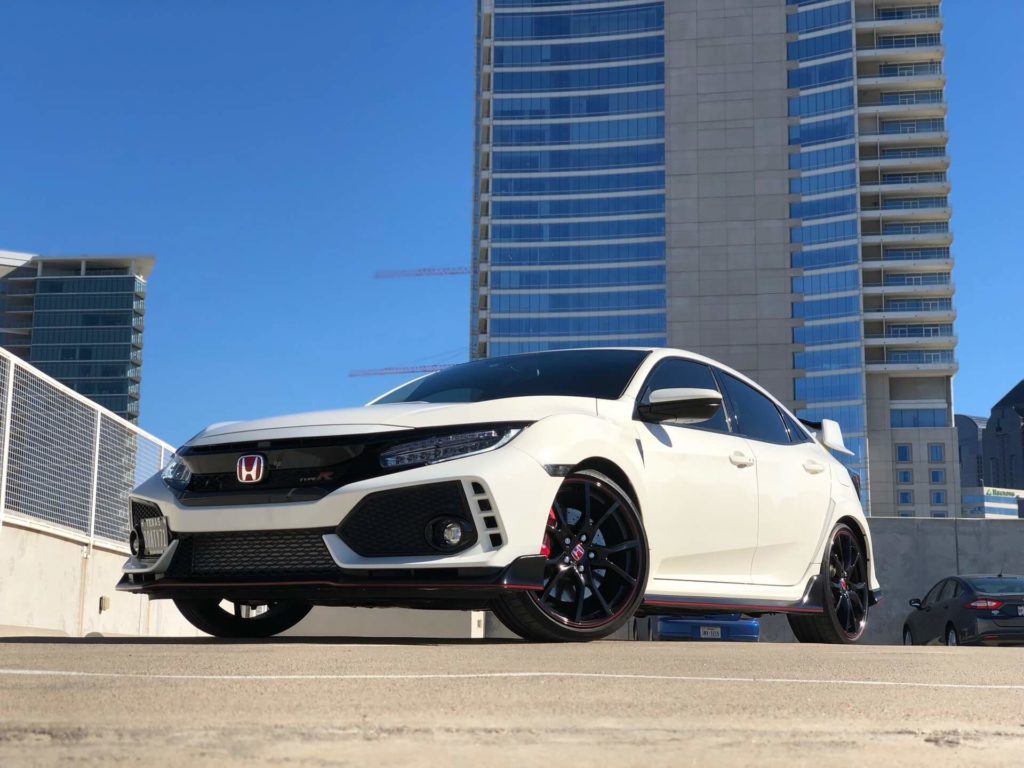 White Honda Civic parked near modern high-rise buildings in Kitchener.