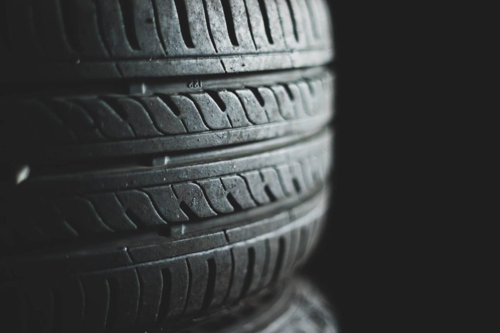 Close-up of tire treads showing wear and tear for safety check.