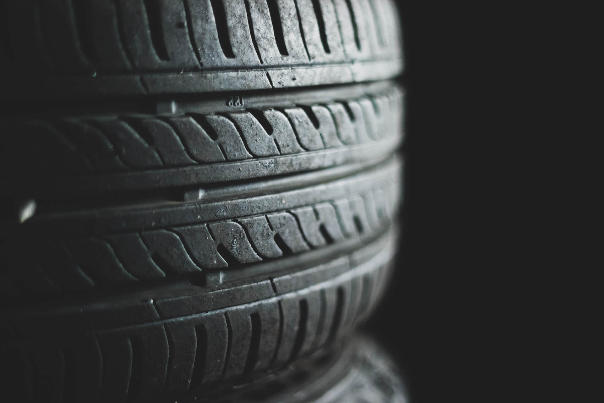 Close-up of tire treads showing wear and tear for safety check.