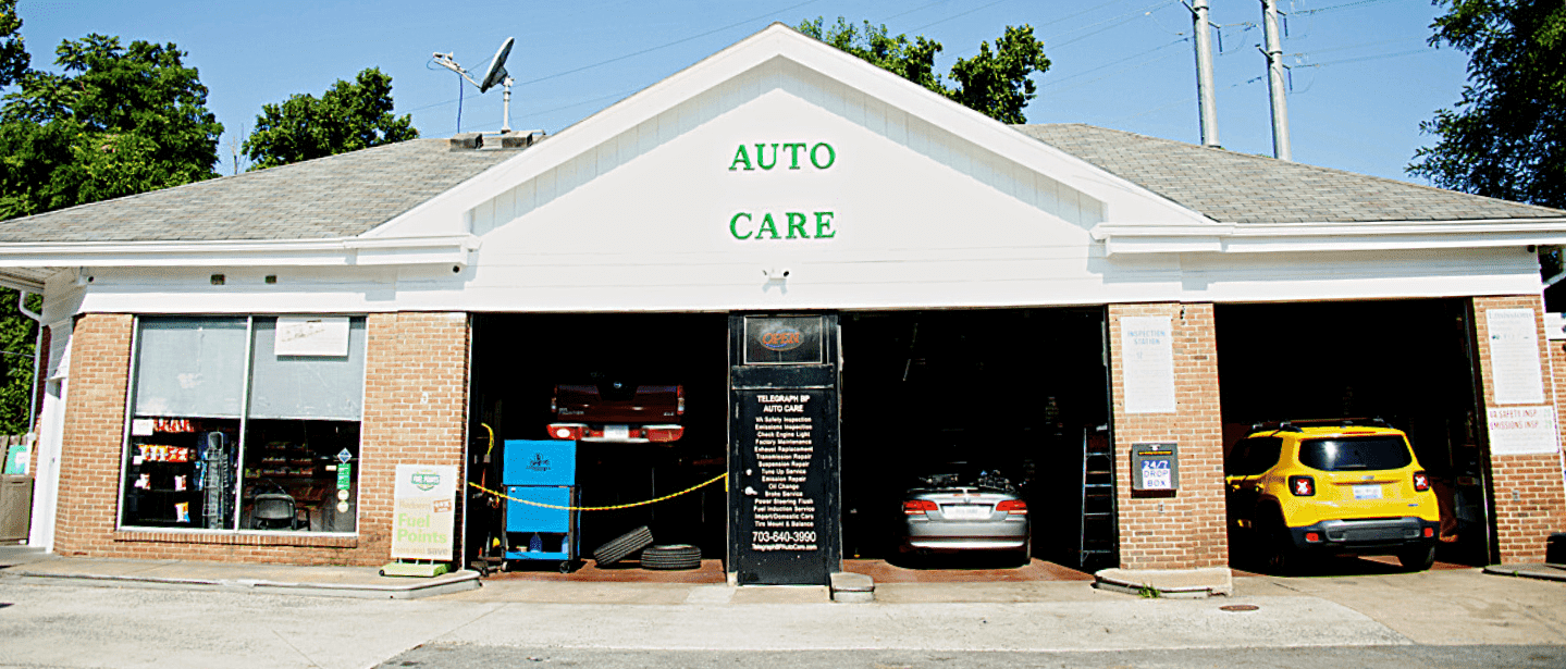 Auto repair shop with cars being serviced and maintained.