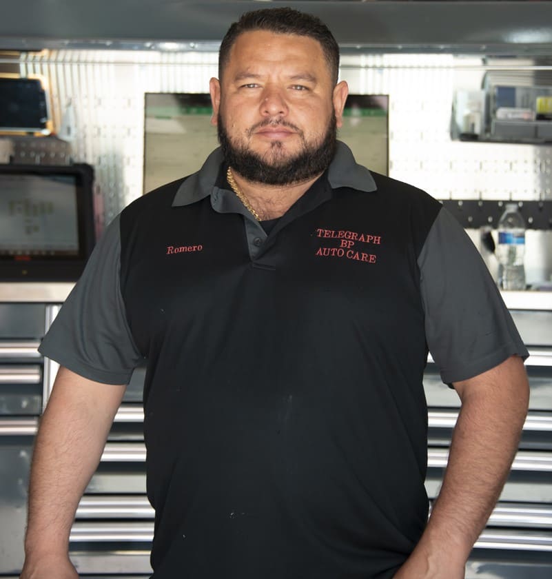 Skilled auto repair technician at Telegraph Auto Care workshop.