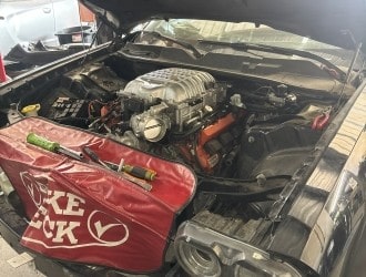 Engine bay featuring upgraded components and Texxaco Racing tools.