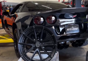 Car with custom wheels at The Auto Lounge, showcasing premium vehicle services.