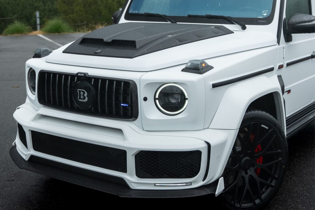 Luxury Mercedes-Benz G-Class SUV with custom black accents and upgraded wheels.