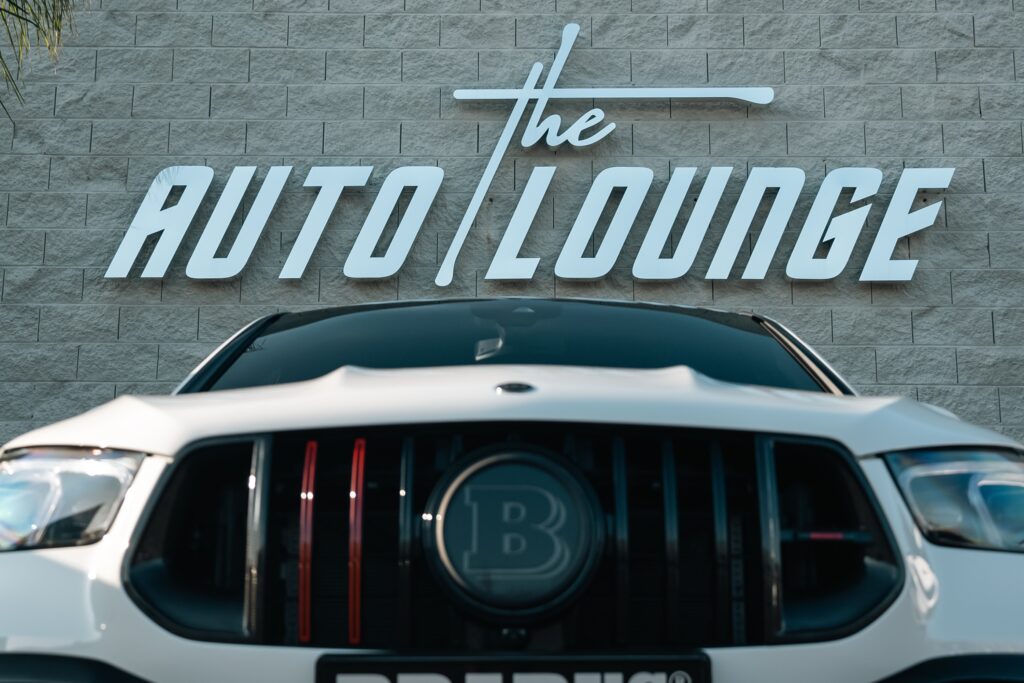 Auto Lounge luxury car dealership exterior.