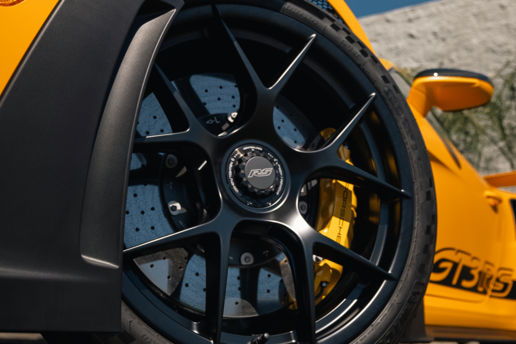 Close-up of a high-performance sports car wheel with yellow brake caliper.