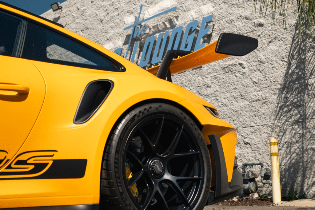 Close-up of a yellow Lamborghini Huracán Performante with black wheels.