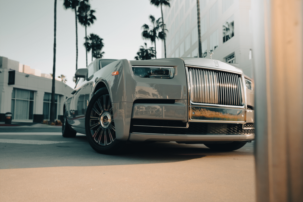 Opulent silver Rolls-Royce showcased at The Auto Lounge, emphasizing premium vehicle collection and.