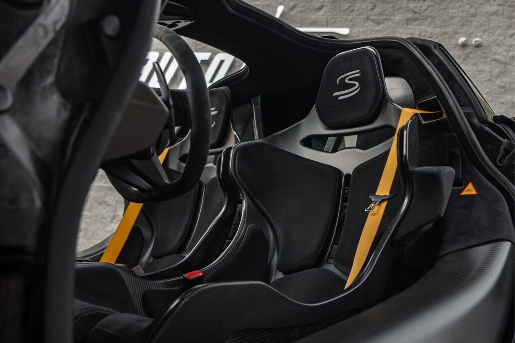 High-performance sports car interior with racing seats and advanced dashboard.