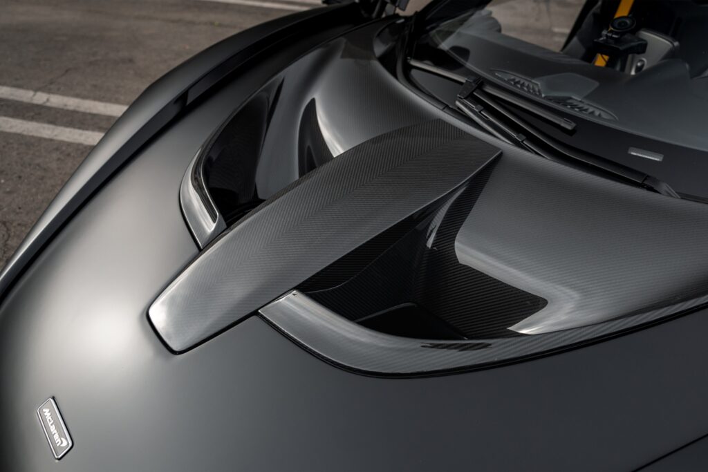 High-performance carbon fiber hood on luxury supercar.
