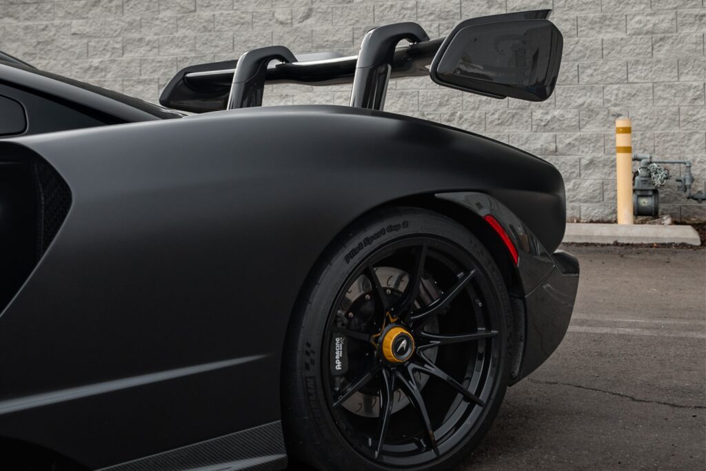 Luxury sports car with sleek black exterior and custom modifications at The Auto Lounge.