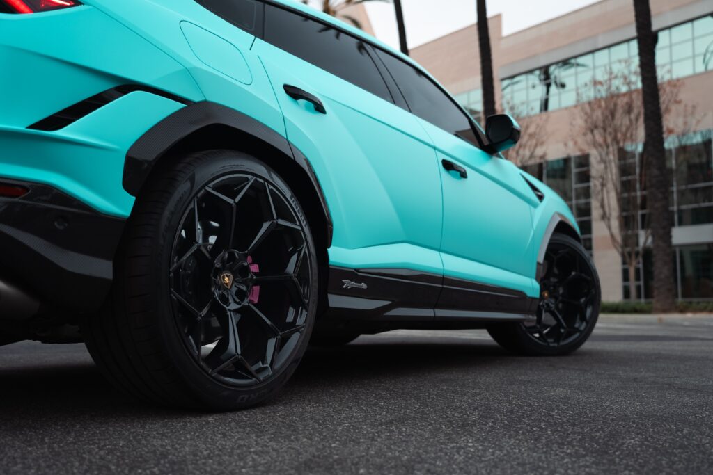 Tesla Model Y electric SUV with sleek design and black alloy wheels.