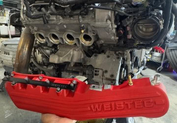 Engine being serviced at The Auto Lounge.