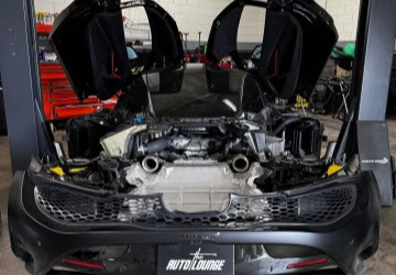 Engine bay of a high-performance sports car with open hood.